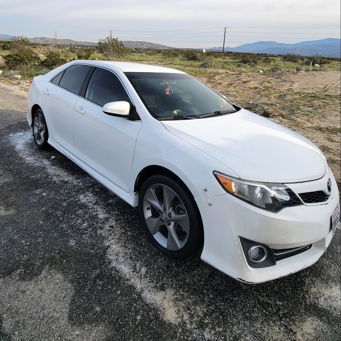 Freshly detailed white Camry in the desert